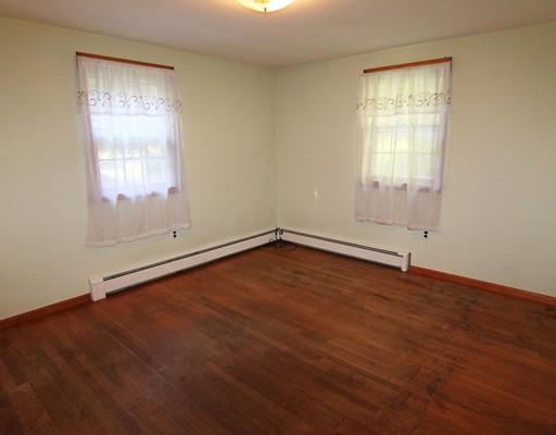 31 Dudley Road Billerica, MA 01821 - Photo 6 of 20 an empty room with wooden floor and windows