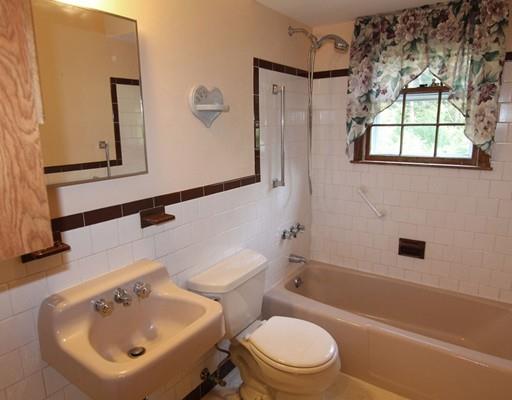 31 Dudley Road Billerica, MA 01821 - Photo 10 of 20 a bathroom with a sink a toilet and shower