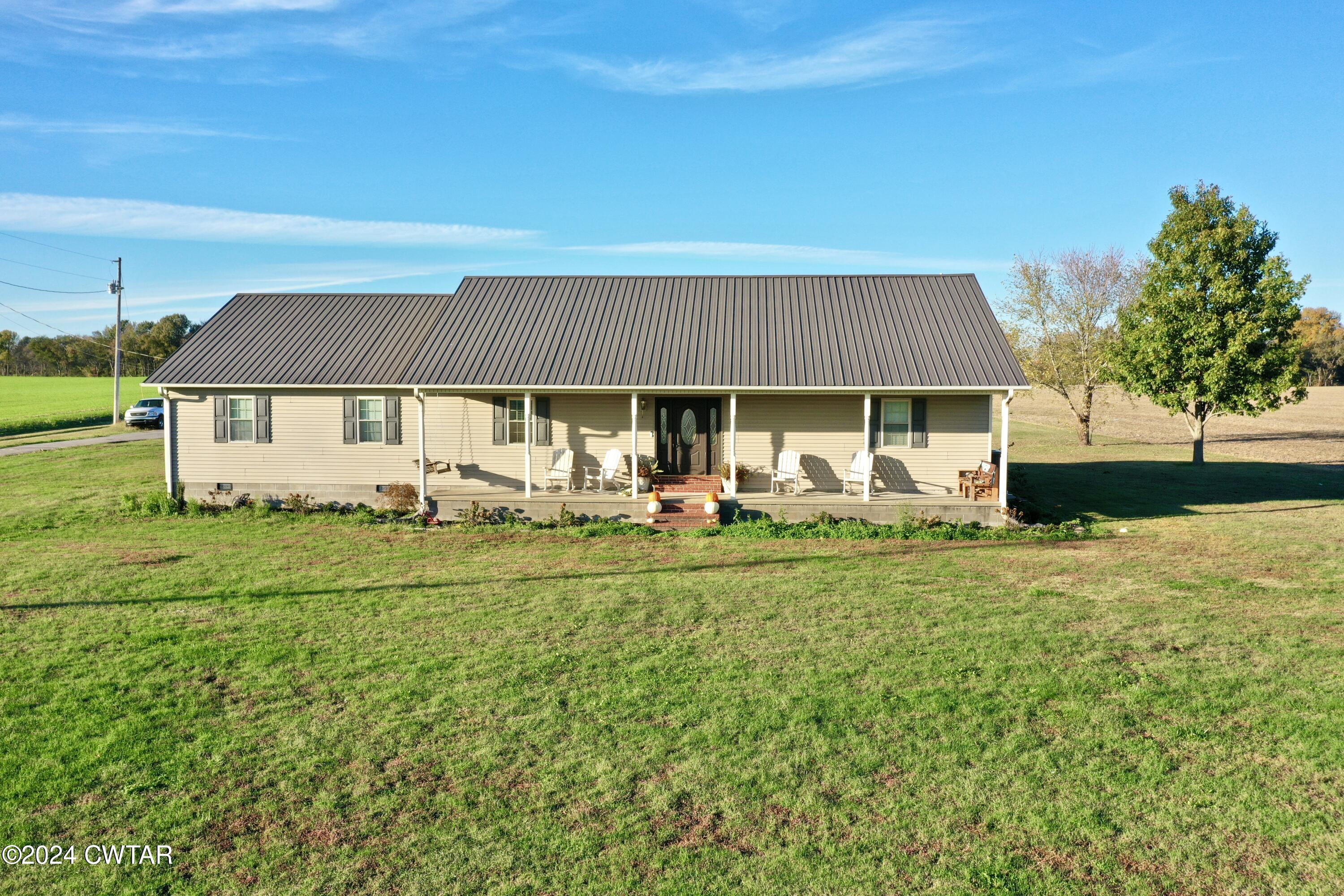 3999 Cloverdale Road Obion, TN 38240 - Photo 1 of 42 a front view of a house with a garden