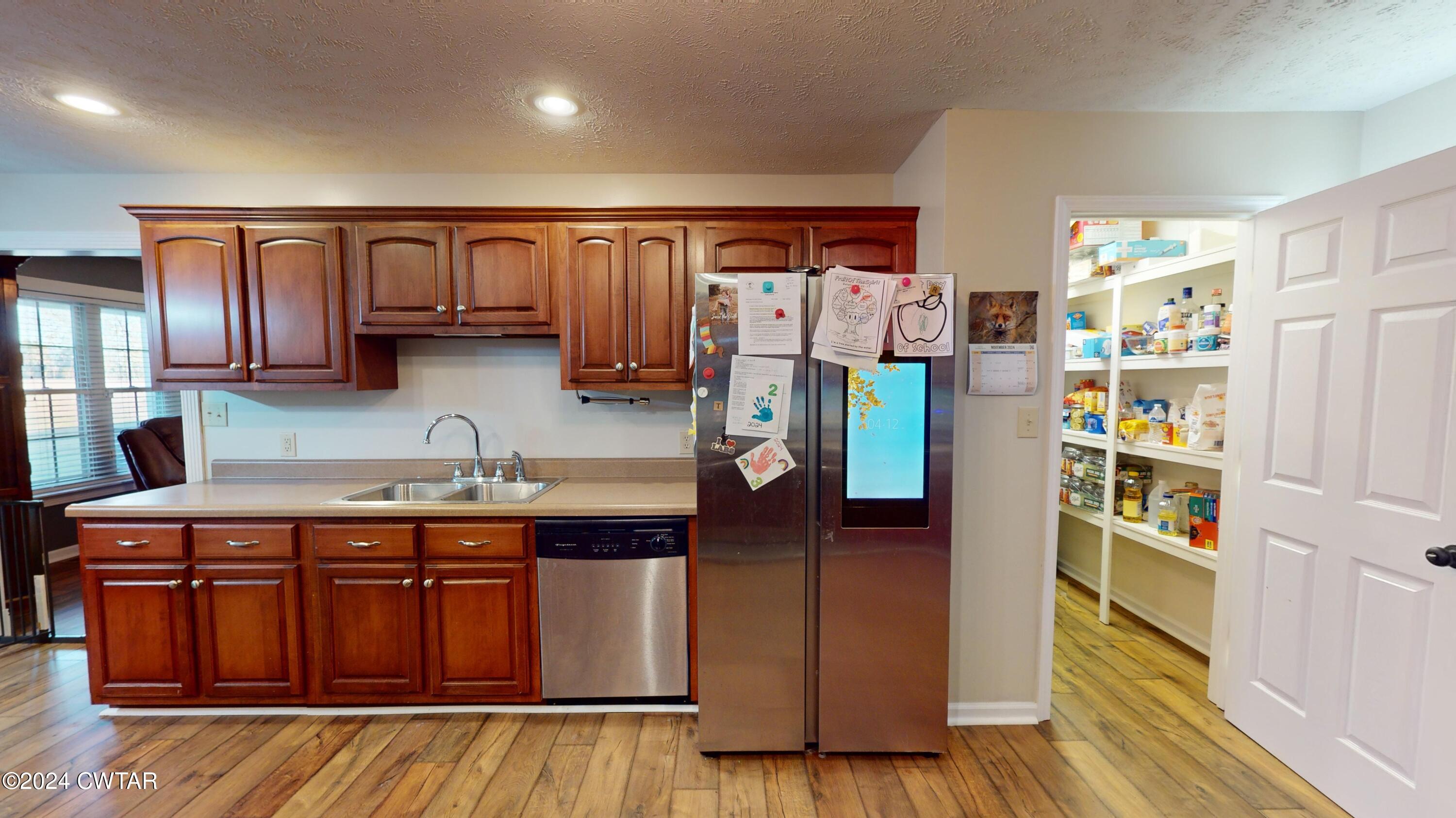 3999 Cloverdale Road Obion, TN 38240 - Photo 12 of 42 a kitchen with stainless steel appliances granite countertop a refrigerator and a sink
