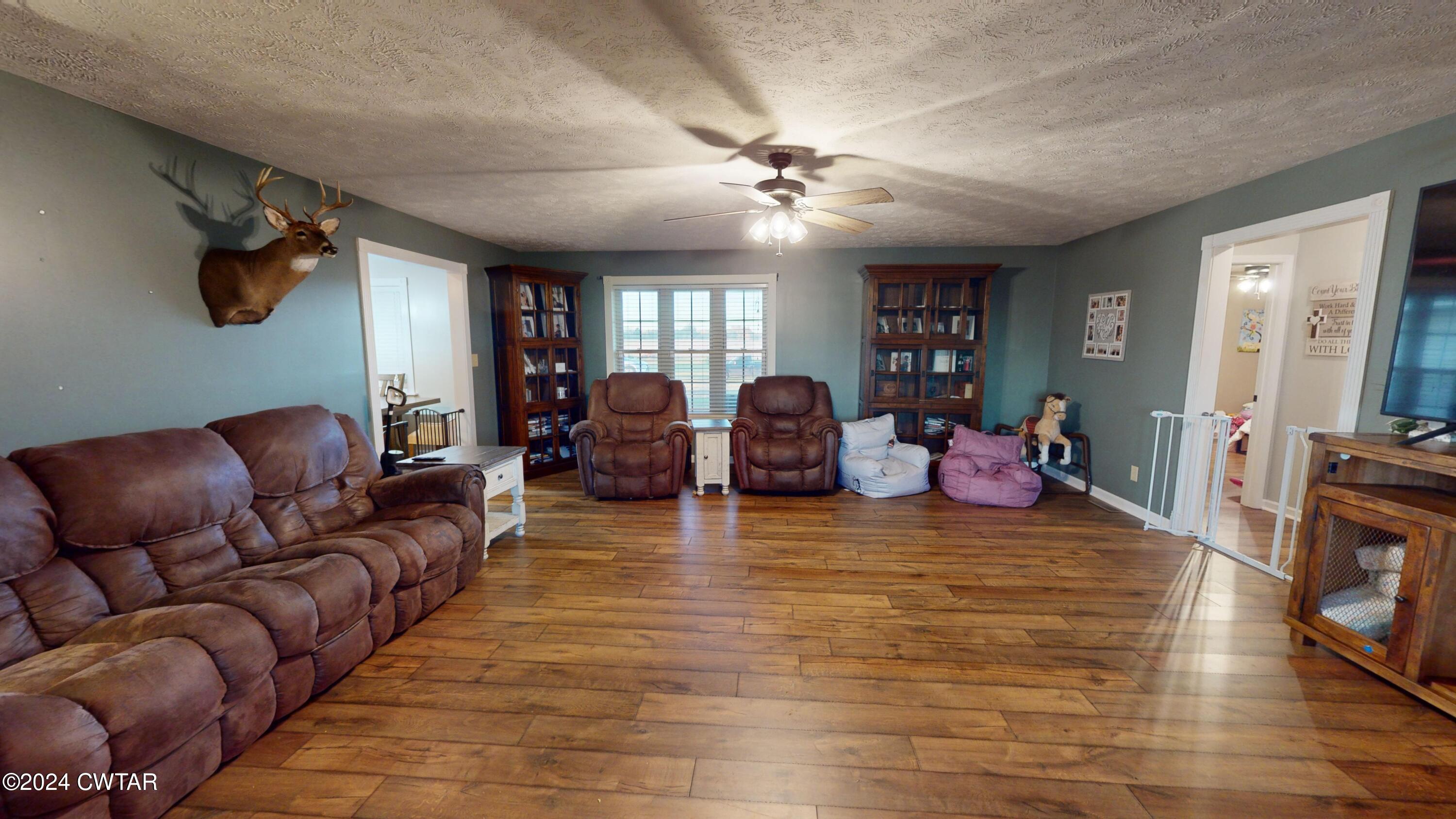 3999 Cloverdale Road Obion, TN 38240 - Photo 2 of 42 a living room with furniture and a wooden floor
