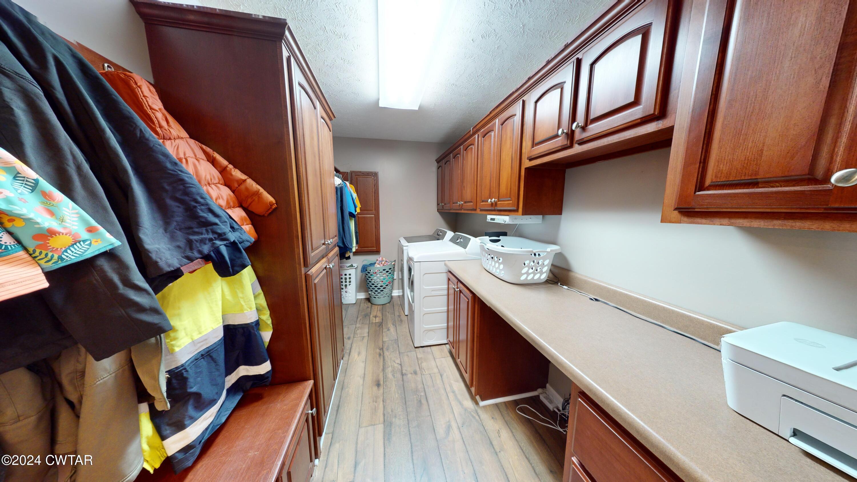 3999 Cloverdale Road Obion, TN 38240 - Photo 21 of 42 a view of walk in closet with clothes and shoes
