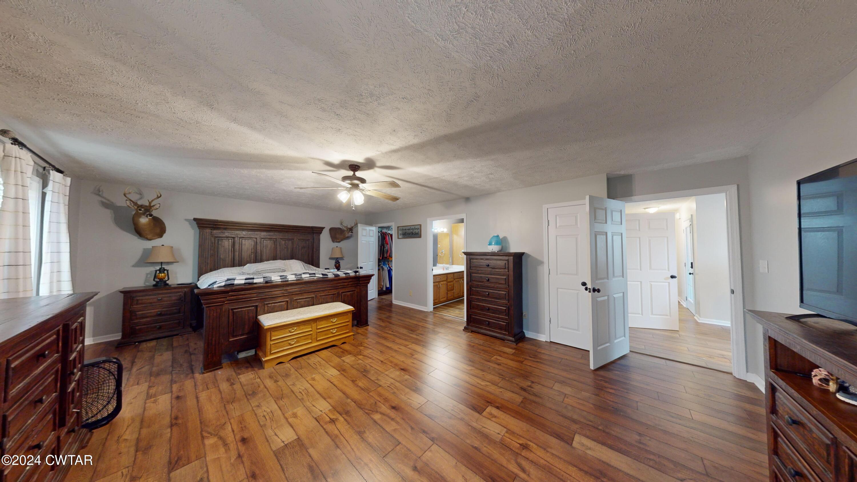 3999 Cloverdale Road Obion, TN 38240 - Photo 23 of 42 a bedroom with furniture and wooden floor