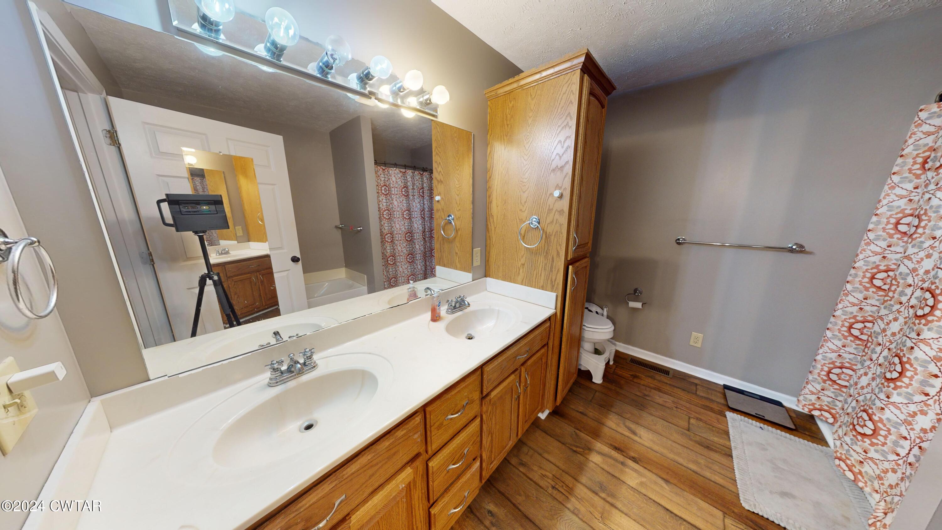 3999 Cloverdale Road Obion, TN 38240 - Photo 25 of 42 a spacious bathroom with a double vanity sink and a mirror