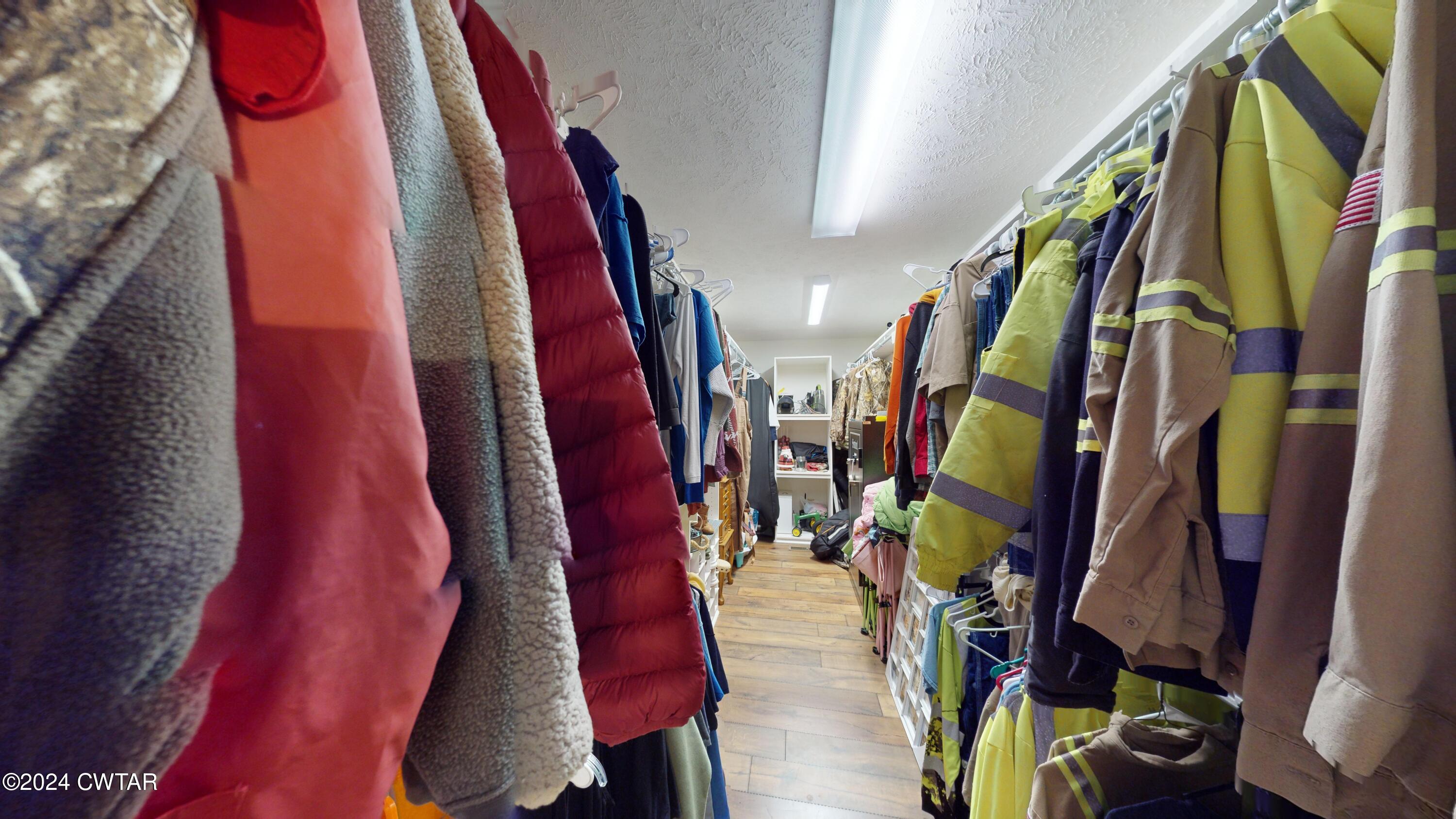 3999 Cloverdale Road Obion, TN 38240 - Photo 27 of 42 a view of walk in closet with clothes and shoes