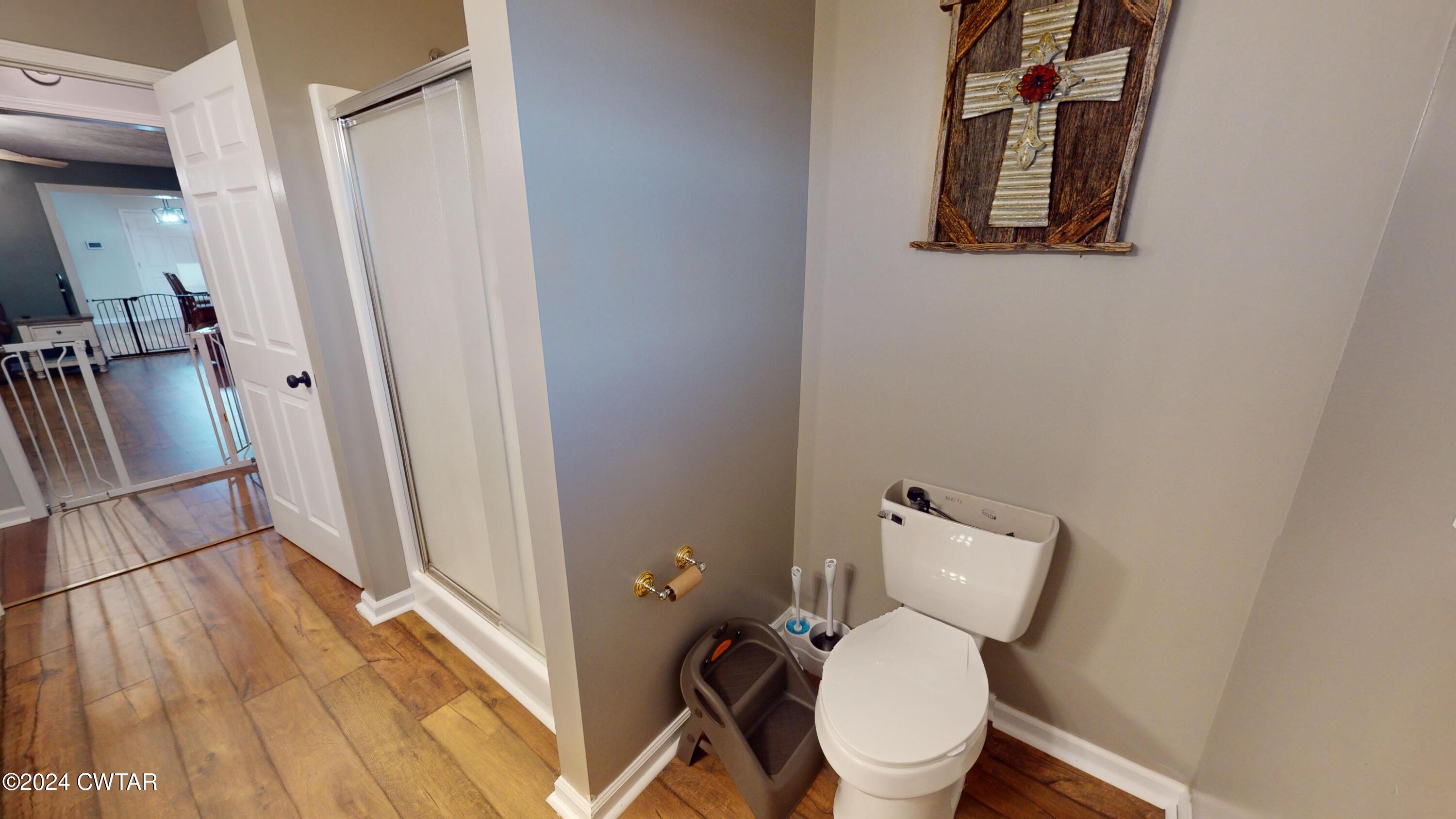 3999 Cloverdale Road Obion, TN 38240 - Photo 33 of 42 a white toilet sitting next to a bathroom sink