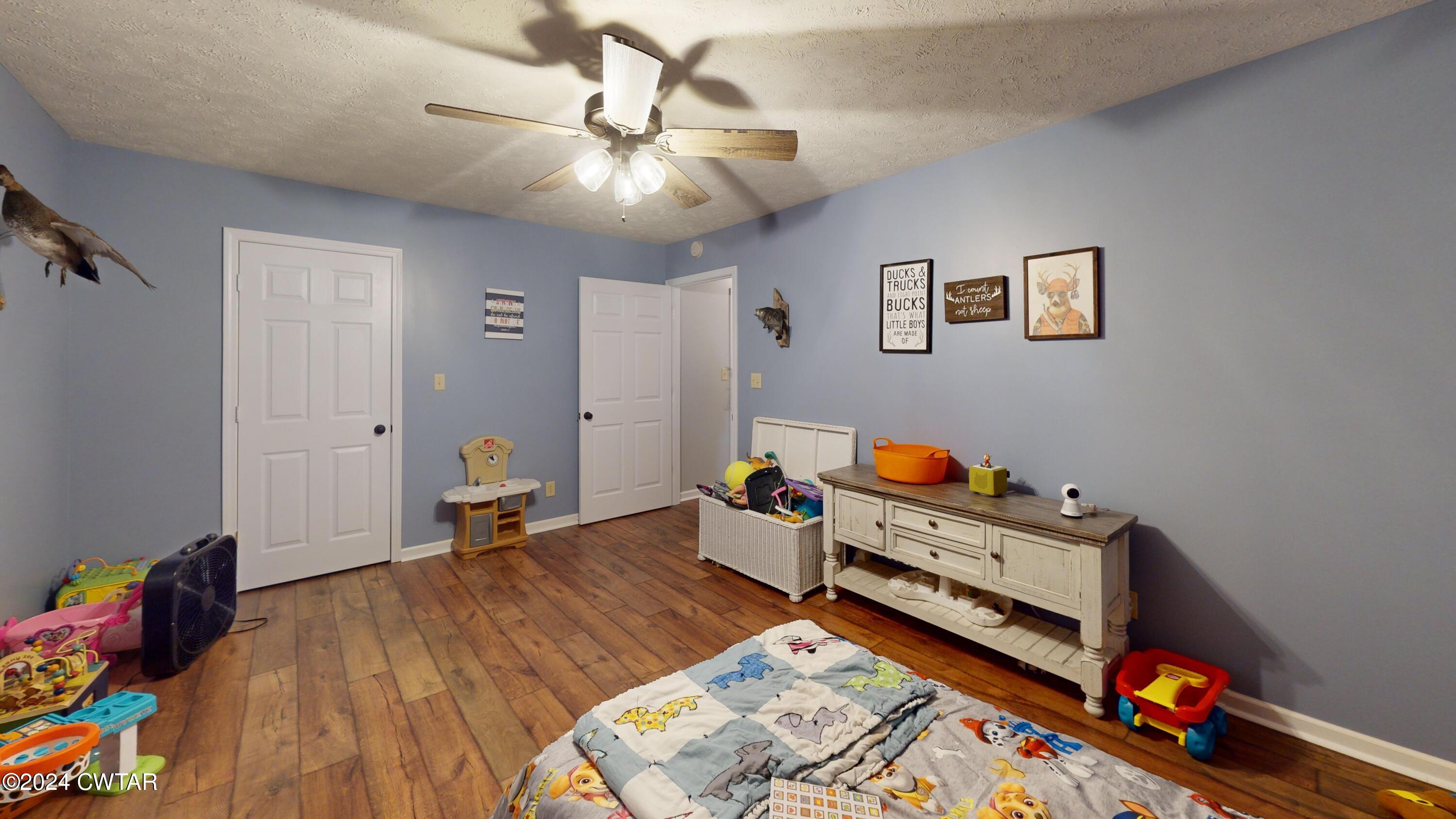 3999 Cloverdale Road Obion, TN 38240 - Photo 35 of 42 a room with furniture and wooden floor