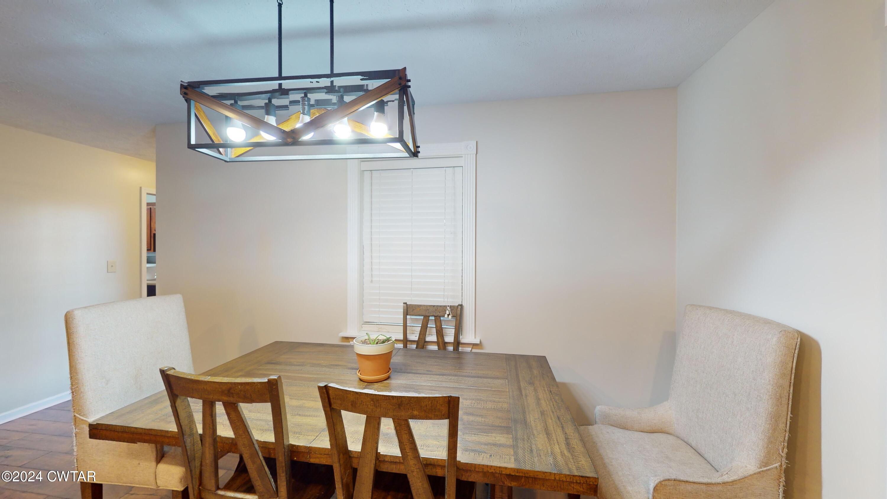 3999 Cloverdale Road Obion, TN 38240 - Photo 5 of 42 a view of a dining room with furniture and wooden floor