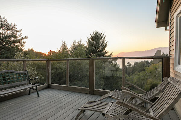 1050 Spring Road Shelter Cove, CA 95589 - Photo 37 of 42 a view of a roof deck with wooden floor and fence
