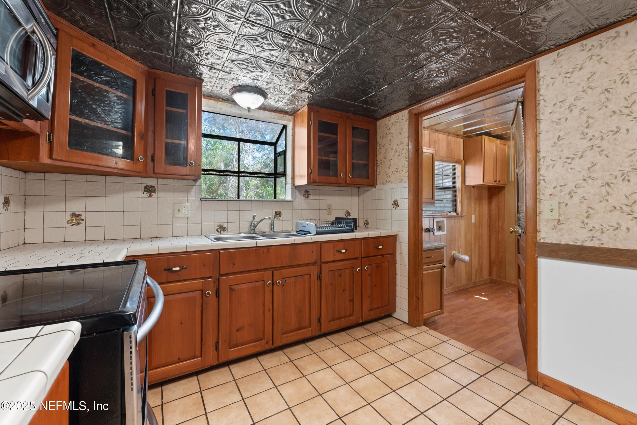 2357 Davis Road Jacksonville, FL 32218 - Photo 12 of 28 a kitchen with stainless steel appliances granite countertop a sink and cabinets