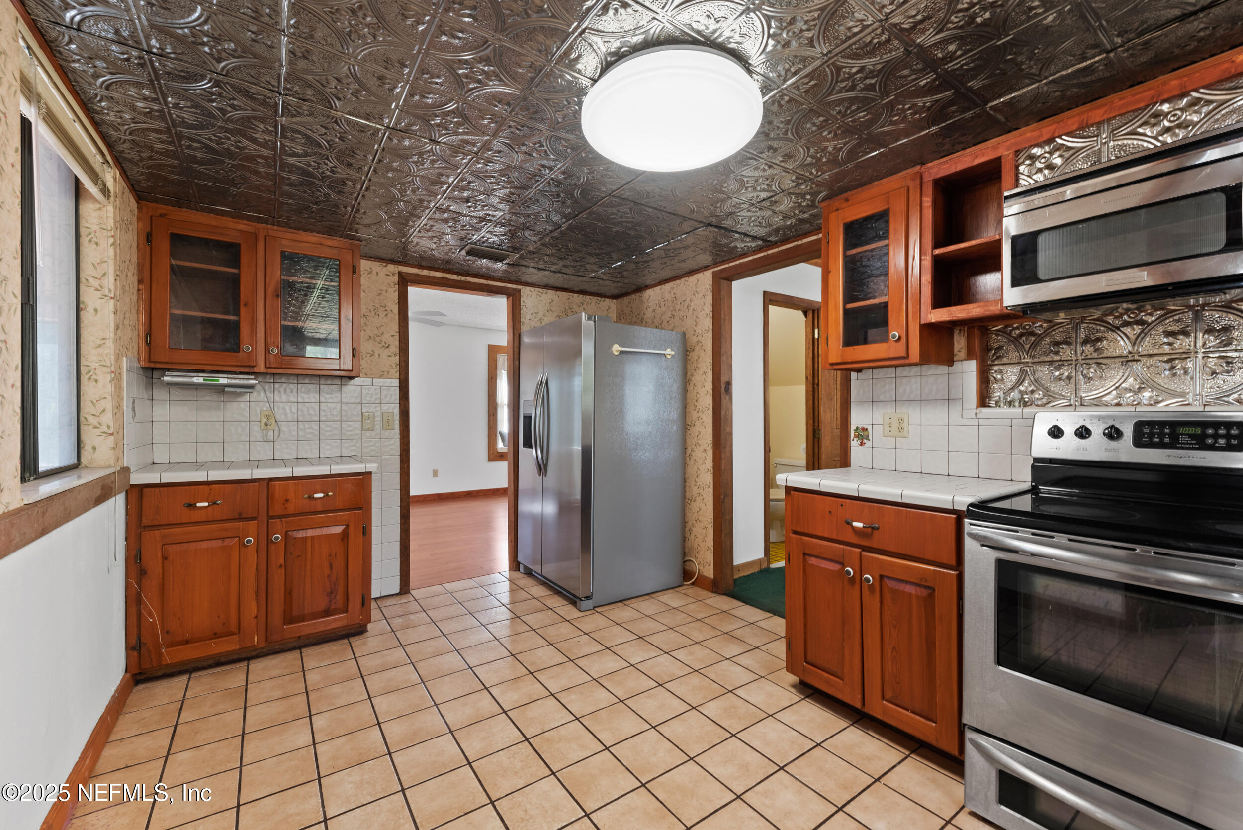 2357 Davis Road Jacksonville, FL 32218 - Photo 13 of 28 a kitchen with stainless steel appliances granite countertop a stove a sink and dishwasher