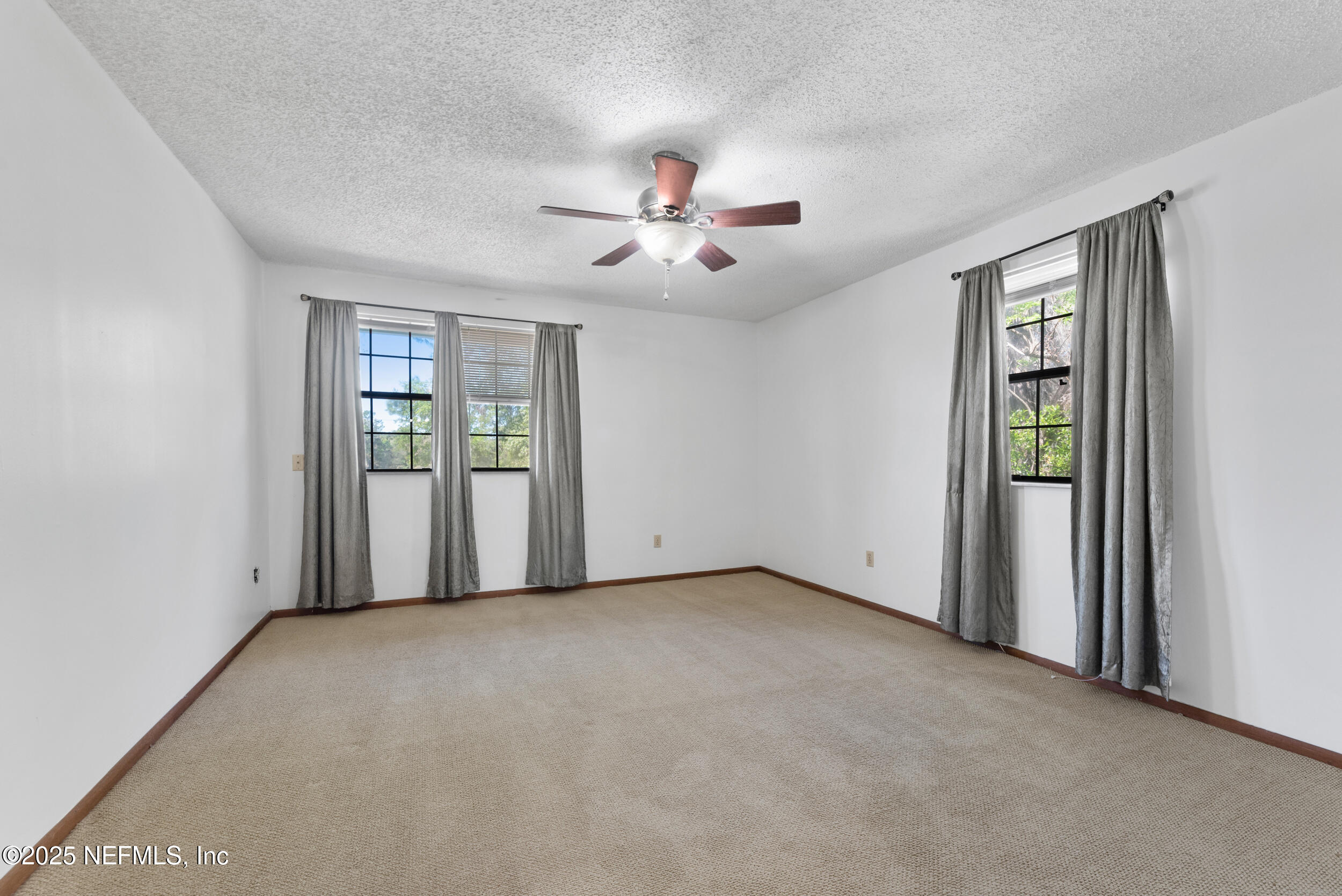 2357 Davis Road Jacksonville, FL 32218 - Photo 14 of 28 a view of an empty room with a window