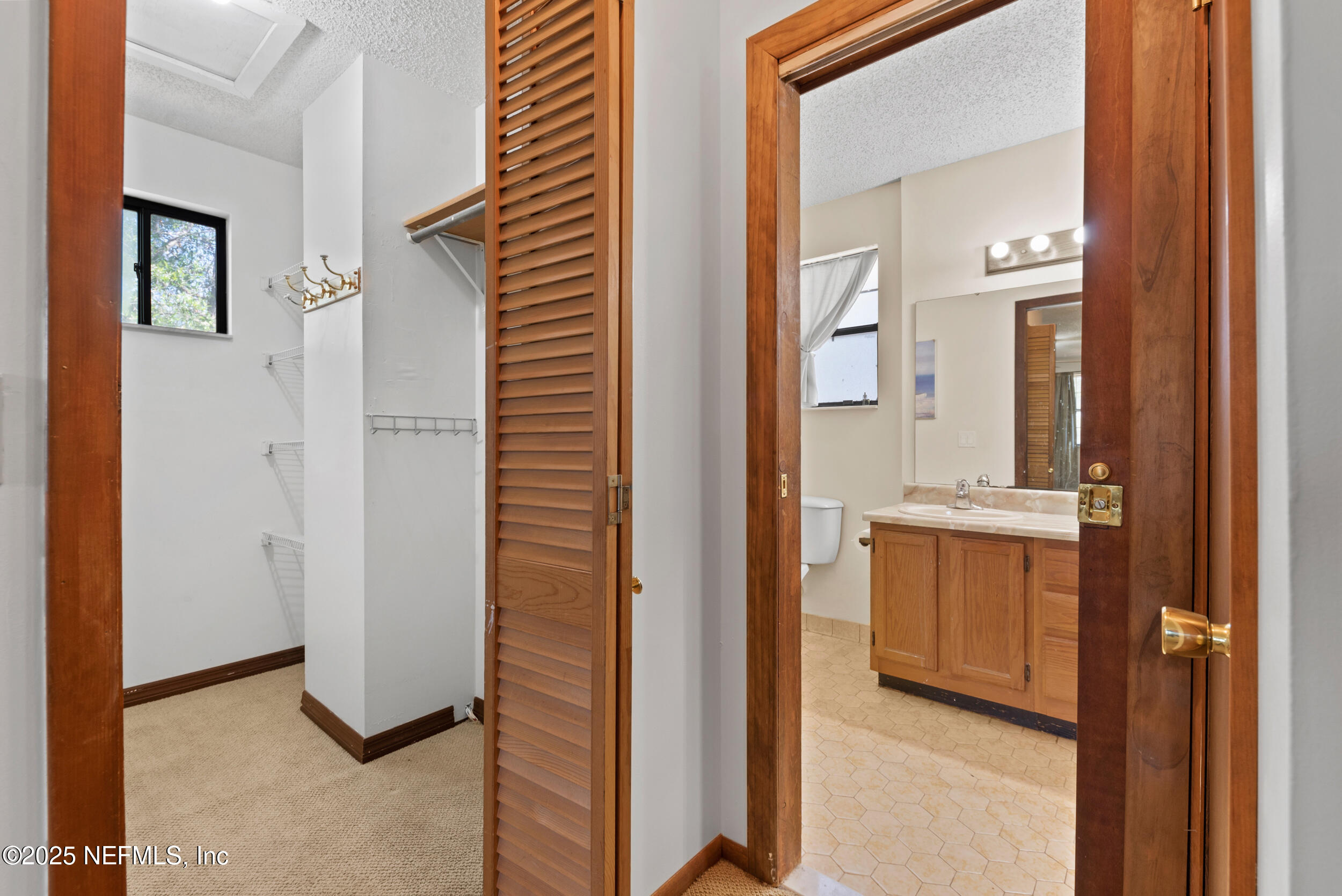 2357 Davis Road Jacksonville, FL 32218 - Photo 16 of 28 a view of a bathroom from a hallway