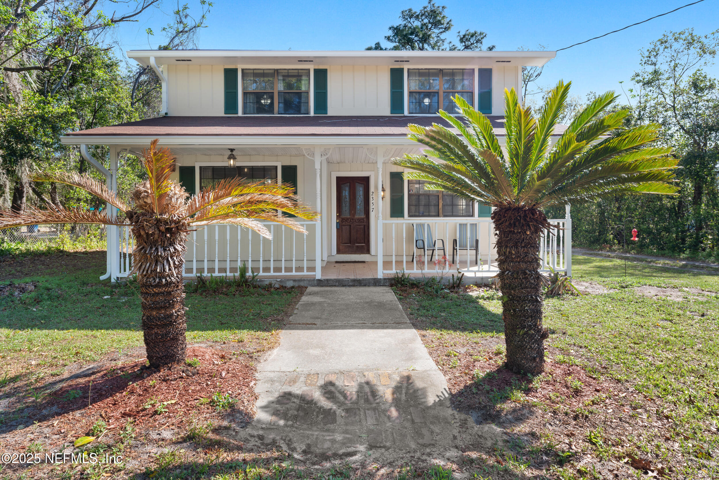 2357 Davis Road Jacksonville, FL 32218 - Photo 2 of 28 a front view of a house with garden