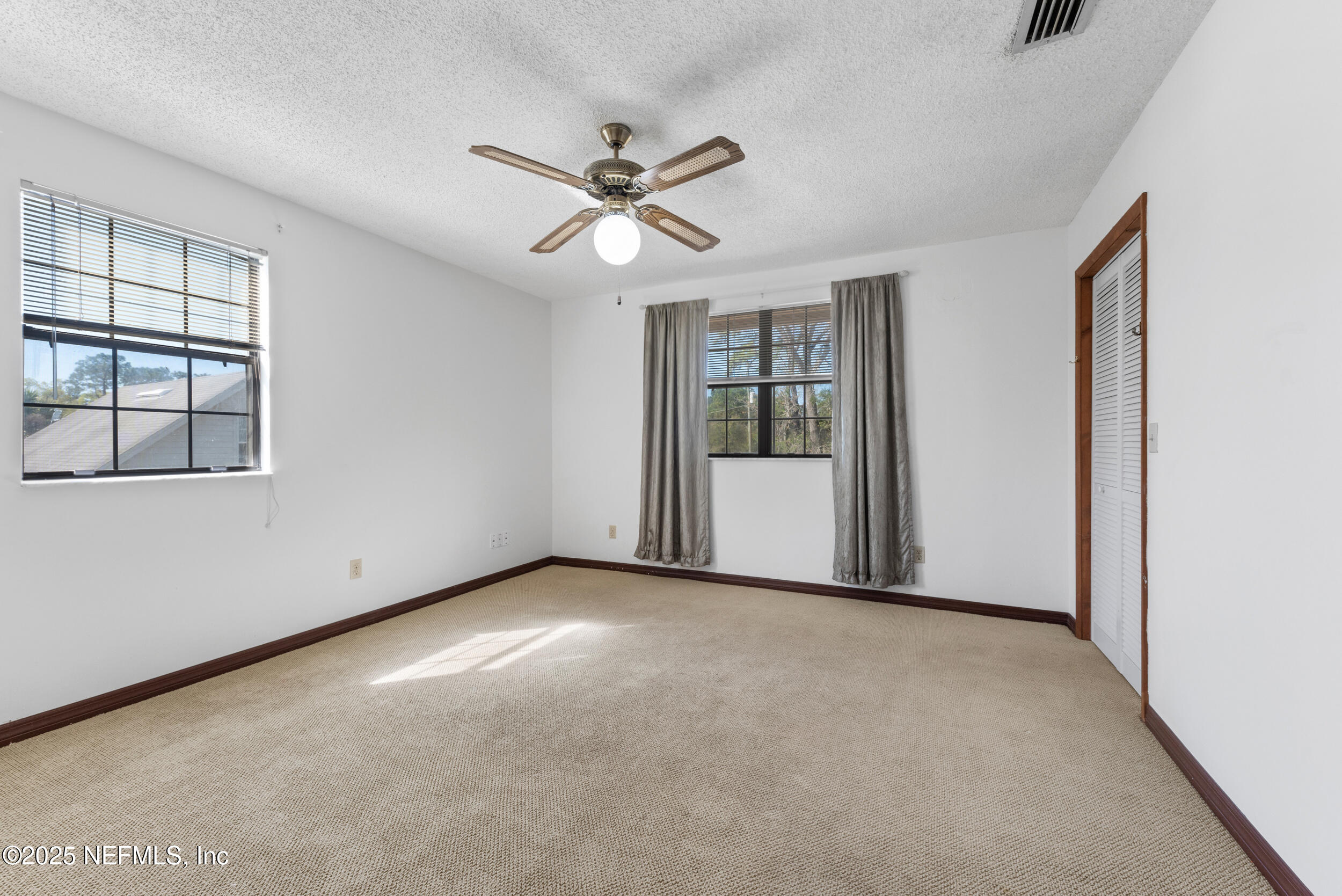 2357 Davis Road Jacksonville, FL 32218 - Photo 21 of 28 a view of an empty room with a window