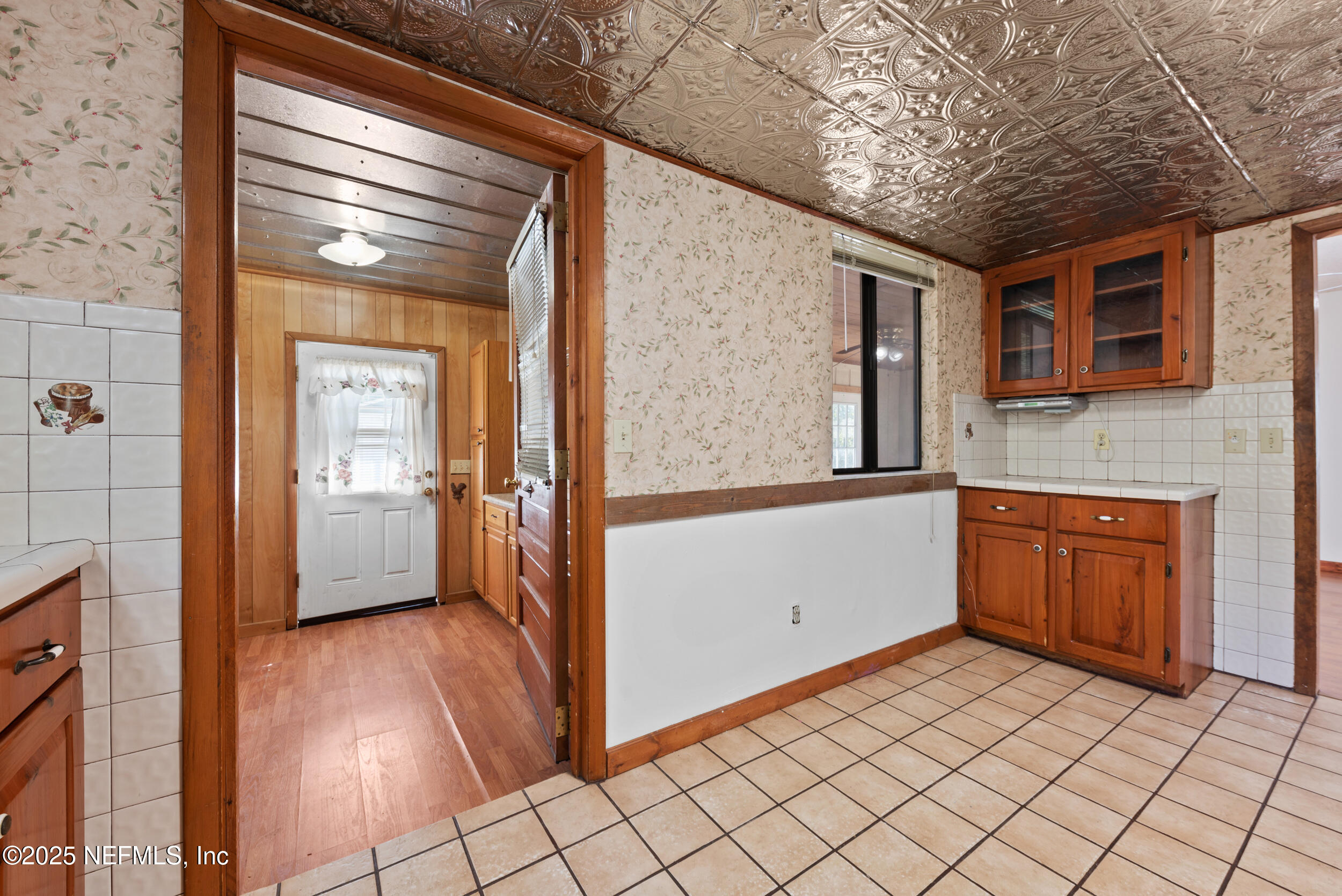 2357 Davis Road Jacksonville, FL 32218 - Photo 23 of 28 a view of a hallway with entryway and wooden floor