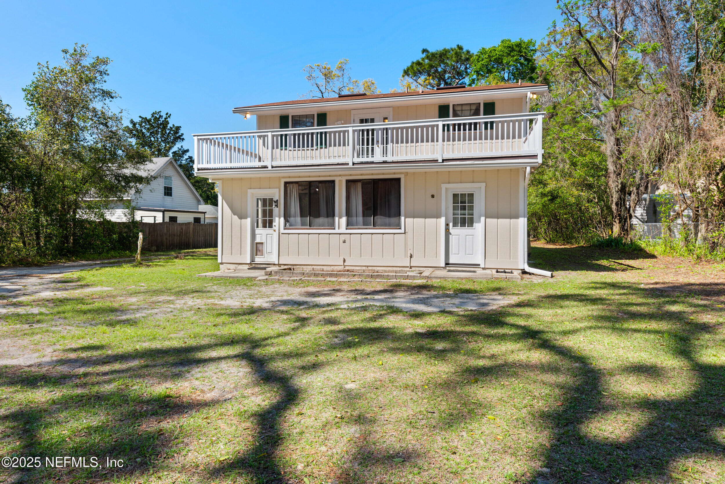 2357 Davis Road Jacksonville, FL 32218 - Photo 24 of 28 a front view of a house with a yard
