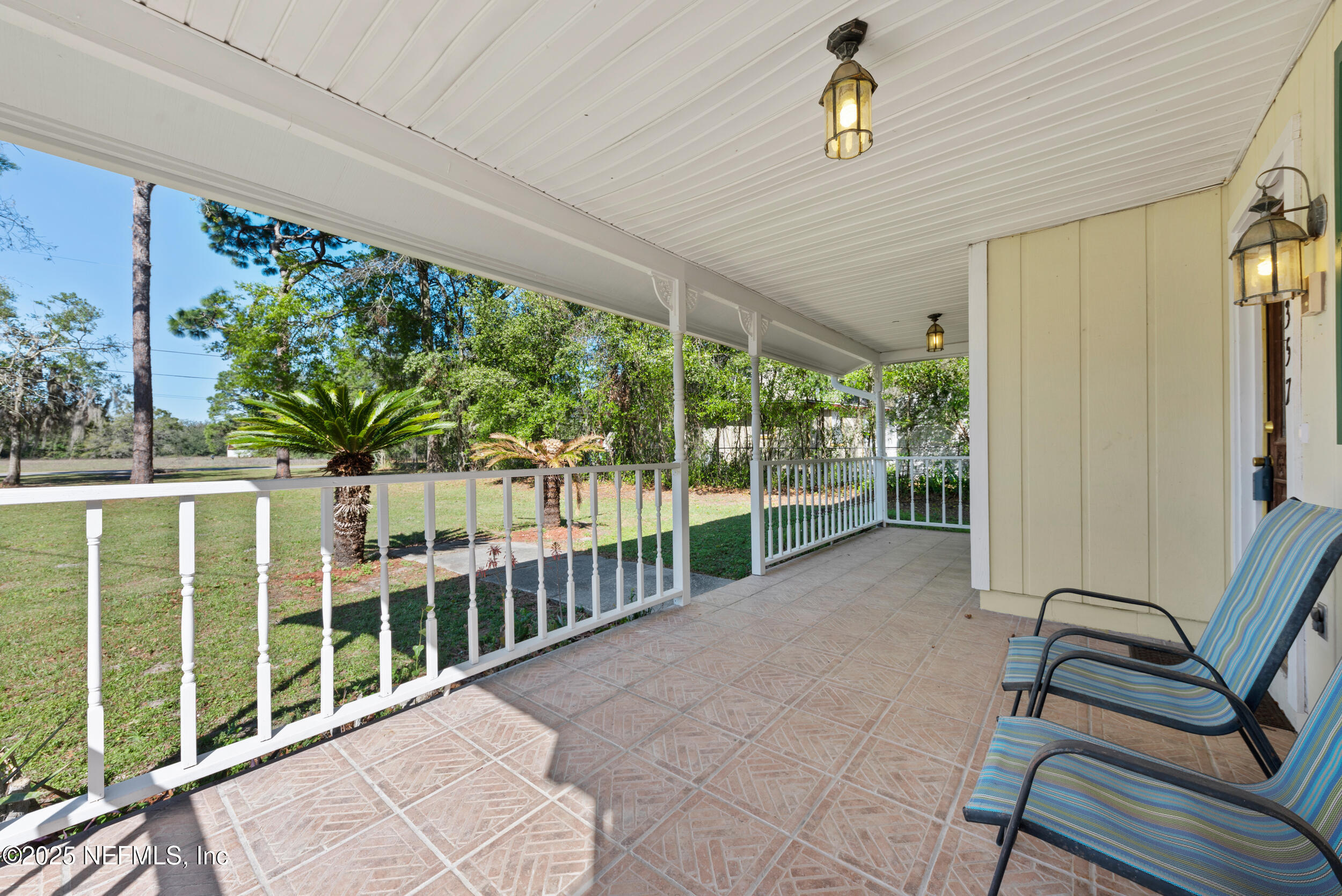 2357 Davis Road Jacksonville, FL 32218 - Photo 3 of 28 a view of a porch with wooden floor