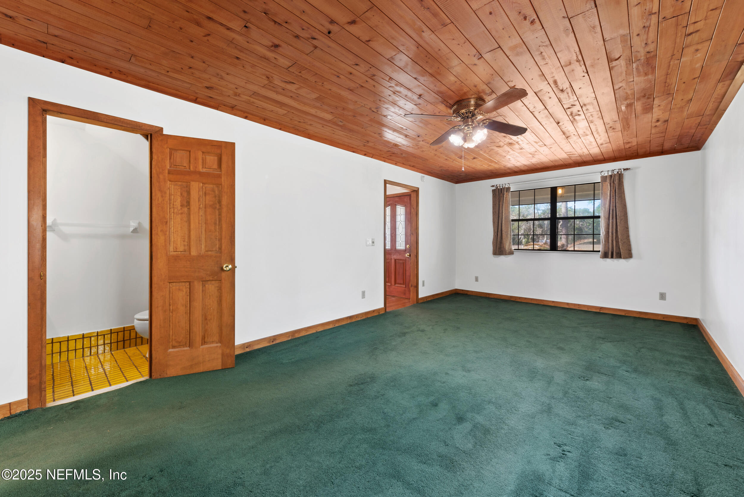 2357 Davis Road Jacksonville, FL 32218 - Photo 8 of 28 an empty room with windows