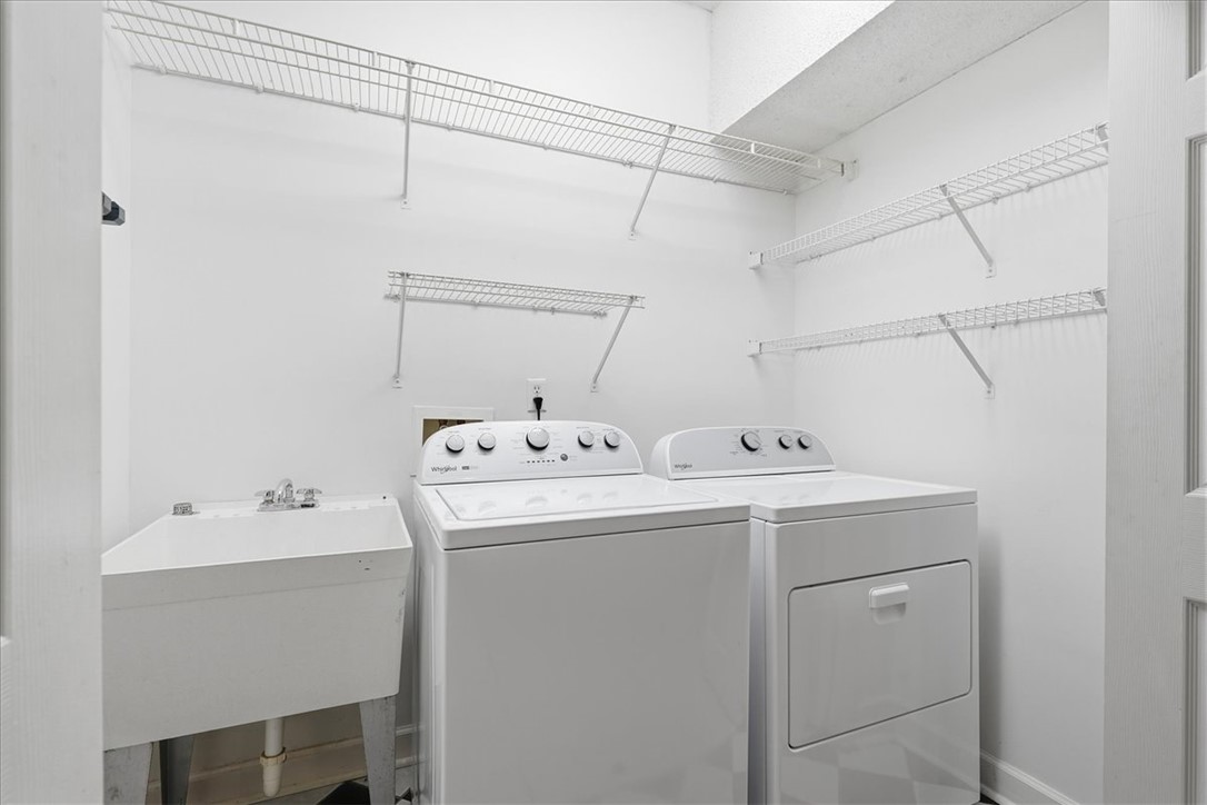 1052 Madden Bridge Road Central, SC 29630 - Photo 35 of 50 A dedicated laundry space features structured wire shelving and a deep utility sink.