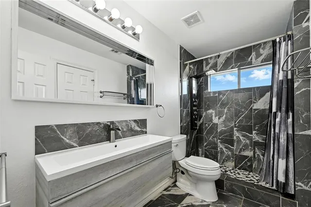 a view of room with wooden floor