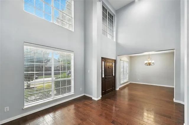 a view of an entryway with wooden floor
