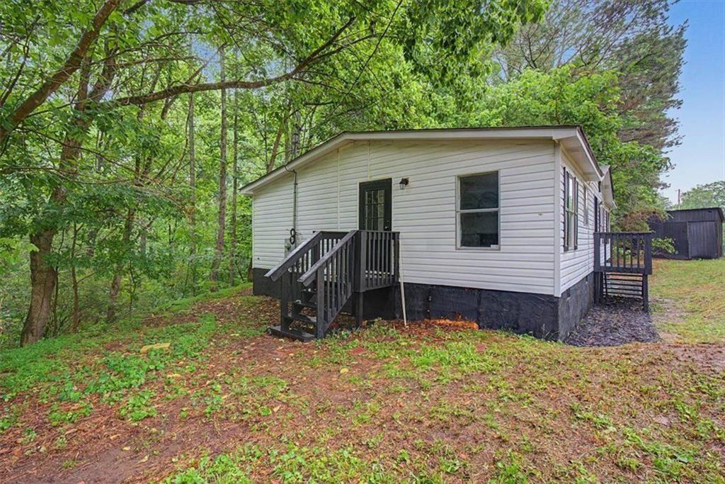 360 Black Knob Church Road Ranger, GA 30734 - Photo 19 of 20 a front view of a house with garden