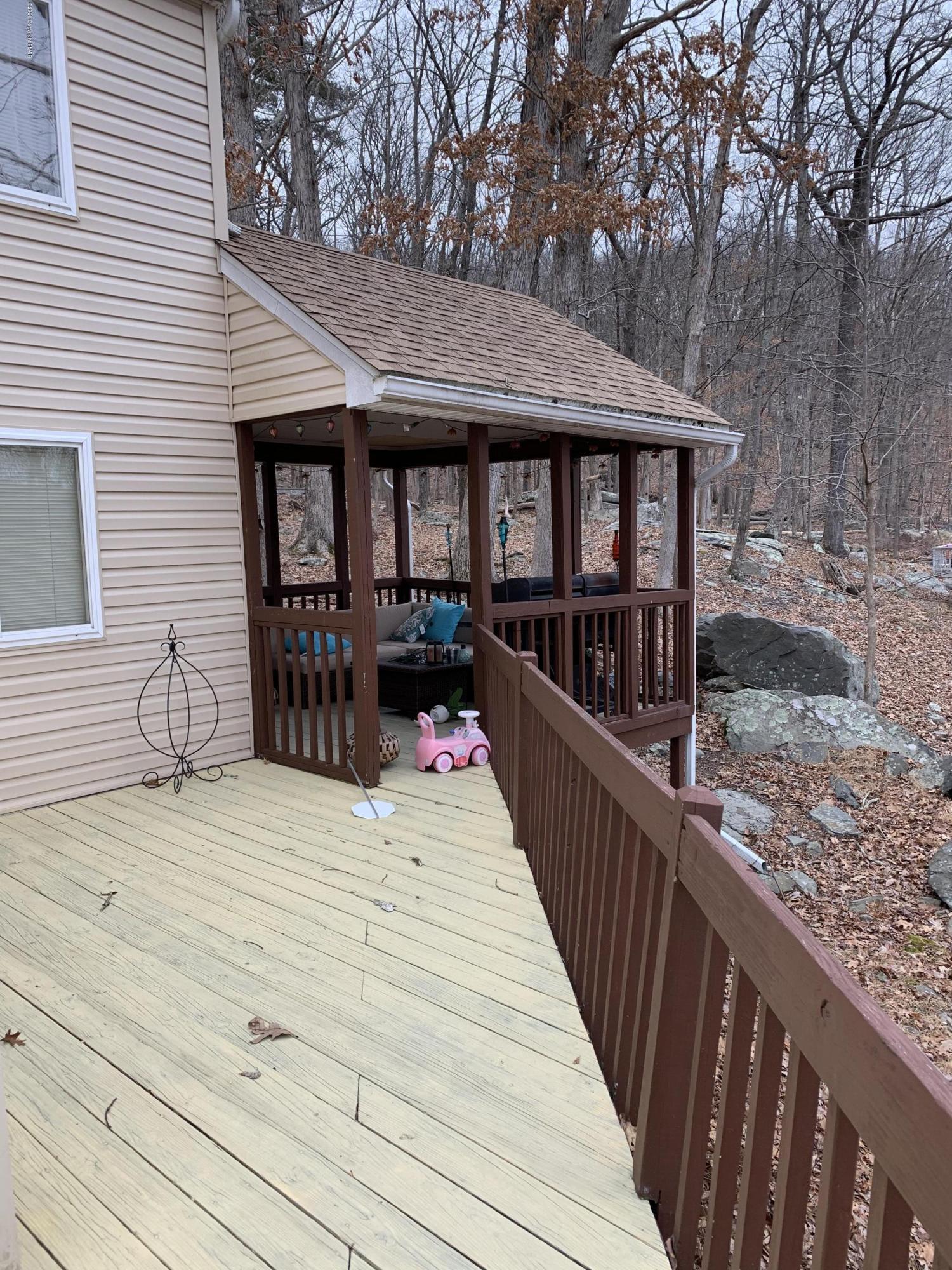 6441 Decker Road Bushkill, PA 18324 - Photo 3 of 19 swimming pool view with wooden floor and fence