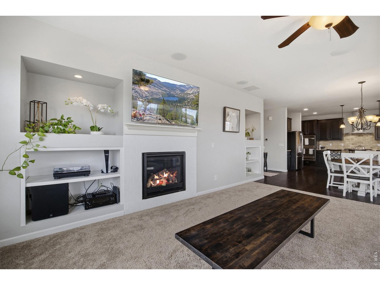 9033 Foxfire Street Firestone, CO 80504 - Photo 18 of 44 a living room with furniture and a fireplace