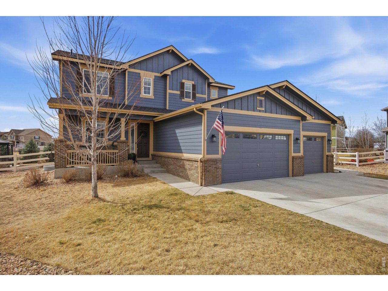 9033 Foxfire Street Firestone, CO 80504 - Photo 2 of 44 a front view of a house with garden