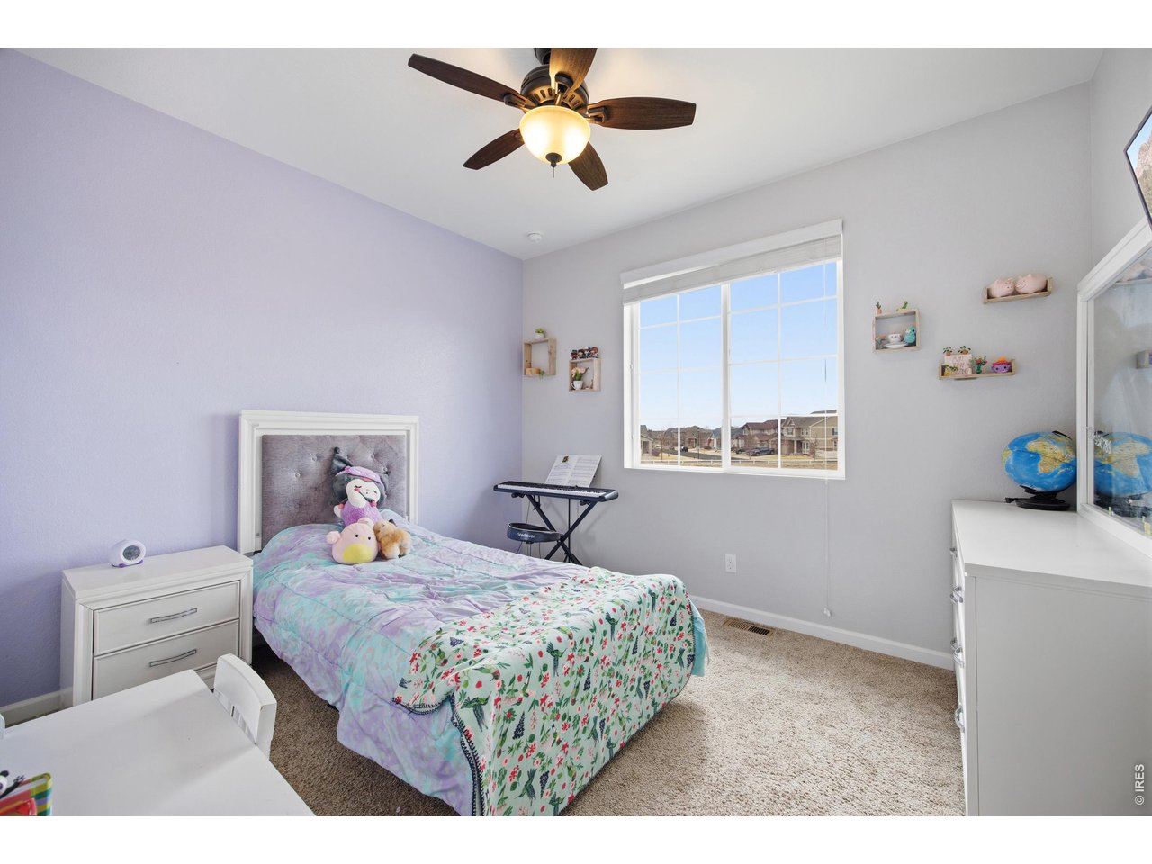 9033 Foxfire Street Firestone, CO 80504 - Photo 31 of 44 a bedroom with a bed and a window in it