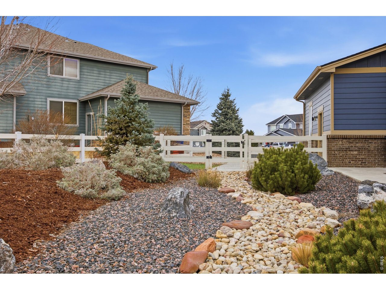 9033 Foxfire Street Firestone, CO 80504 - Photo 40 of 44 a view of a house with a backyard