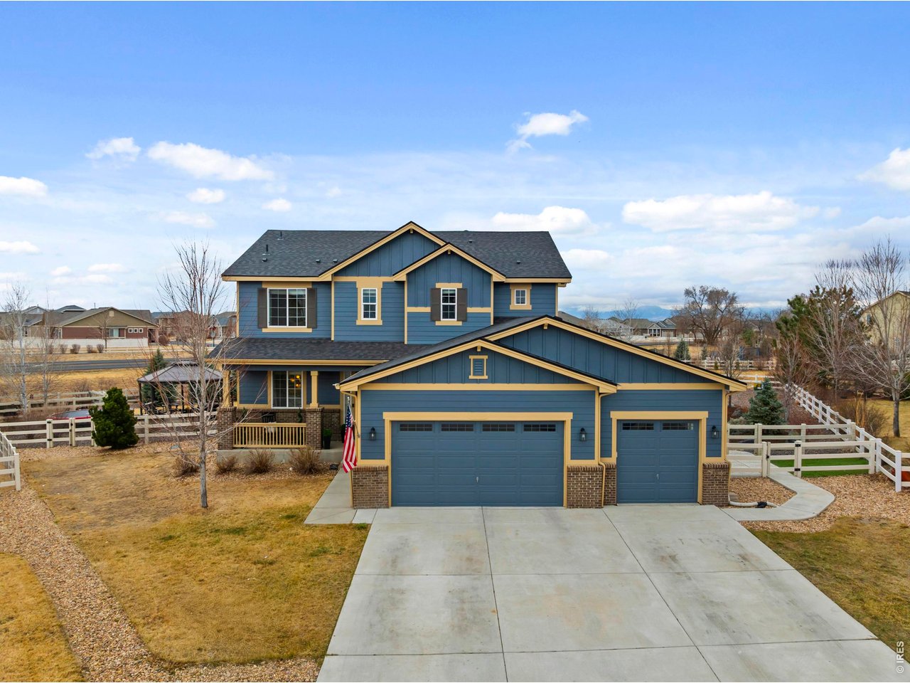 9033 Foxfire Street Firestone, CO 80504 - Photo 4 of 44 a front view of a house with a yard