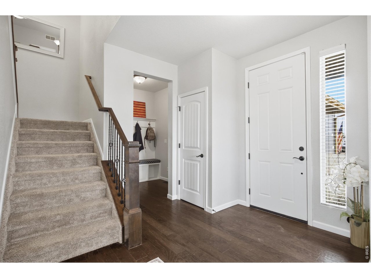 9033 Foxfire Street Firestone, CO 80504 - Photo 6 of 44 a view of entryway with wooden floor