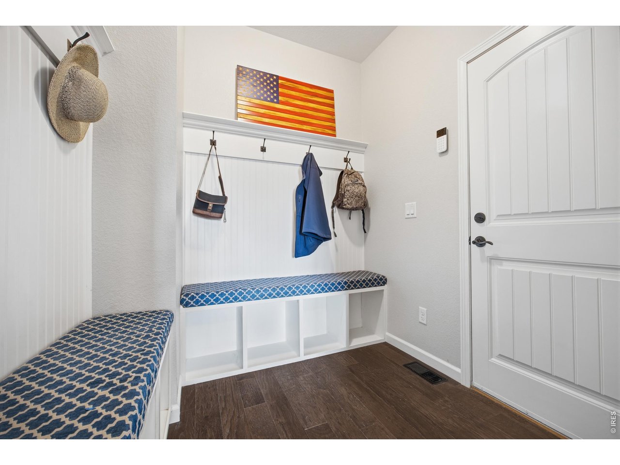 9033 Foxfire Street Firestone, CO 80504 - Photo 7 of 44 a bedroom with a bed and a painting on the wall