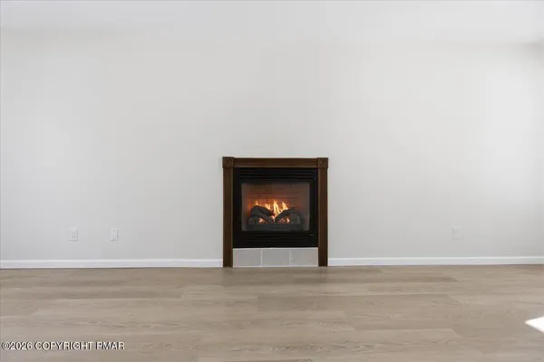 a bedroom with bed and flat screen tv
