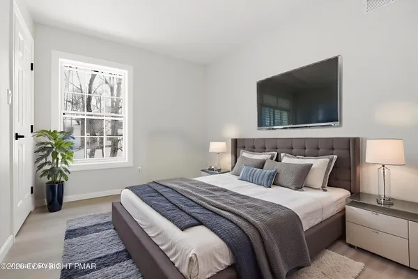 a room with furniture and a flat screen tv