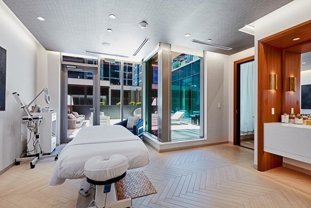 a very nice looking room with a large window and furniture