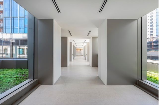 a view of a hallway with windows