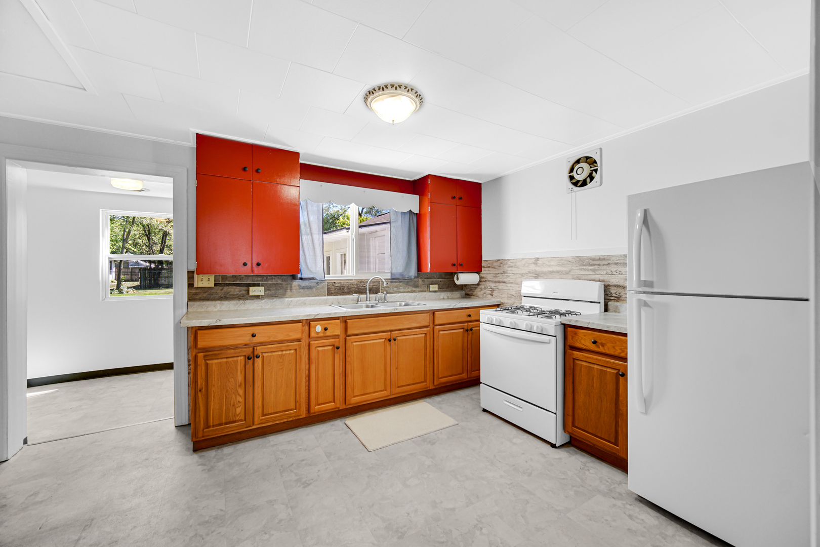 5201 Bell Avenue Portage, IN 46368 - Photo 13 of 16 a kitchen with stainless steel appliances granite countertop a refrigerator a sink and a stove