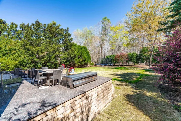 an aerial view of a house with outdoor space