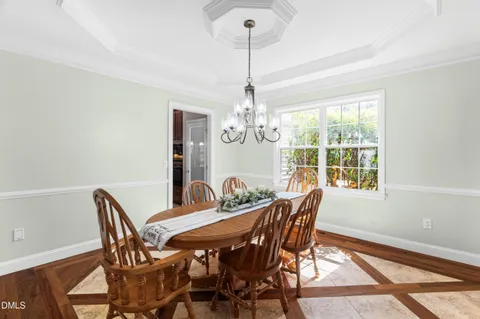 a kitchen with stainless steel appliances granite countertop a refrigerator a sink and a stove