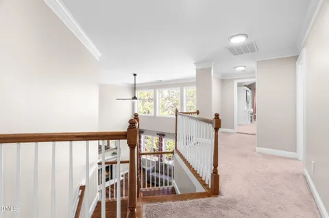 a view of a hallway with staircase