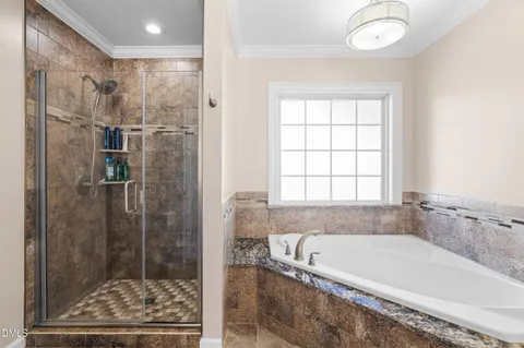 a bathroom with a granite countertop double vanity sink a mirror and a toilet