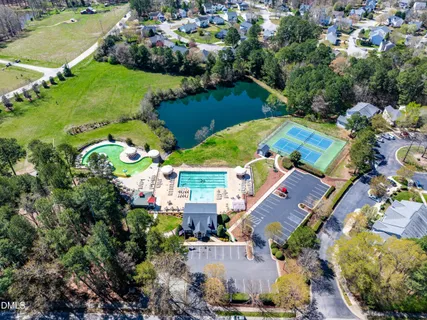 a view of a swimming pool with a yard