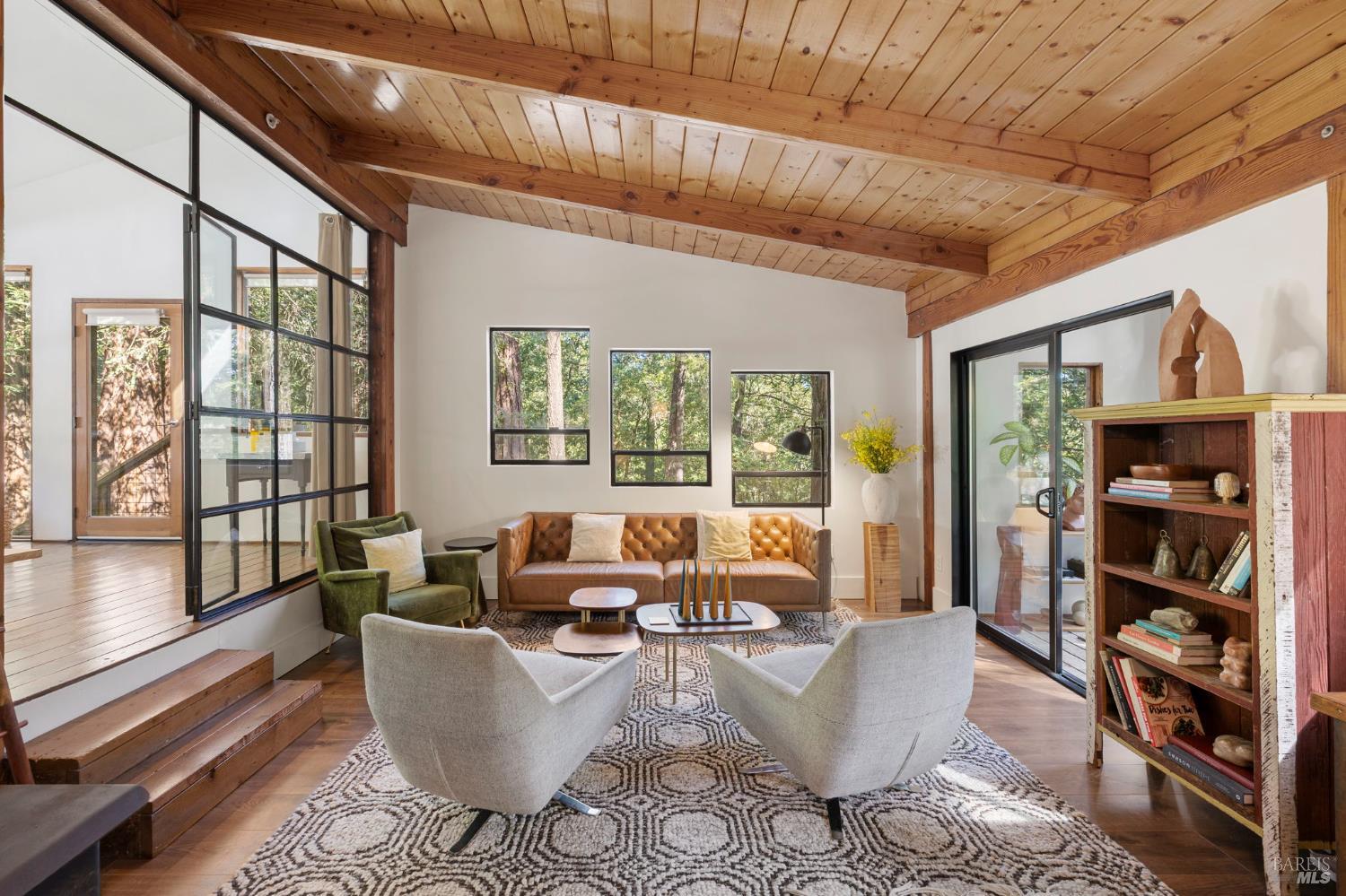 16798 Armstrong Woods Road Guerneville, CA 95446 - Photo 11 of 71 a living room with furniture a rug and a large window