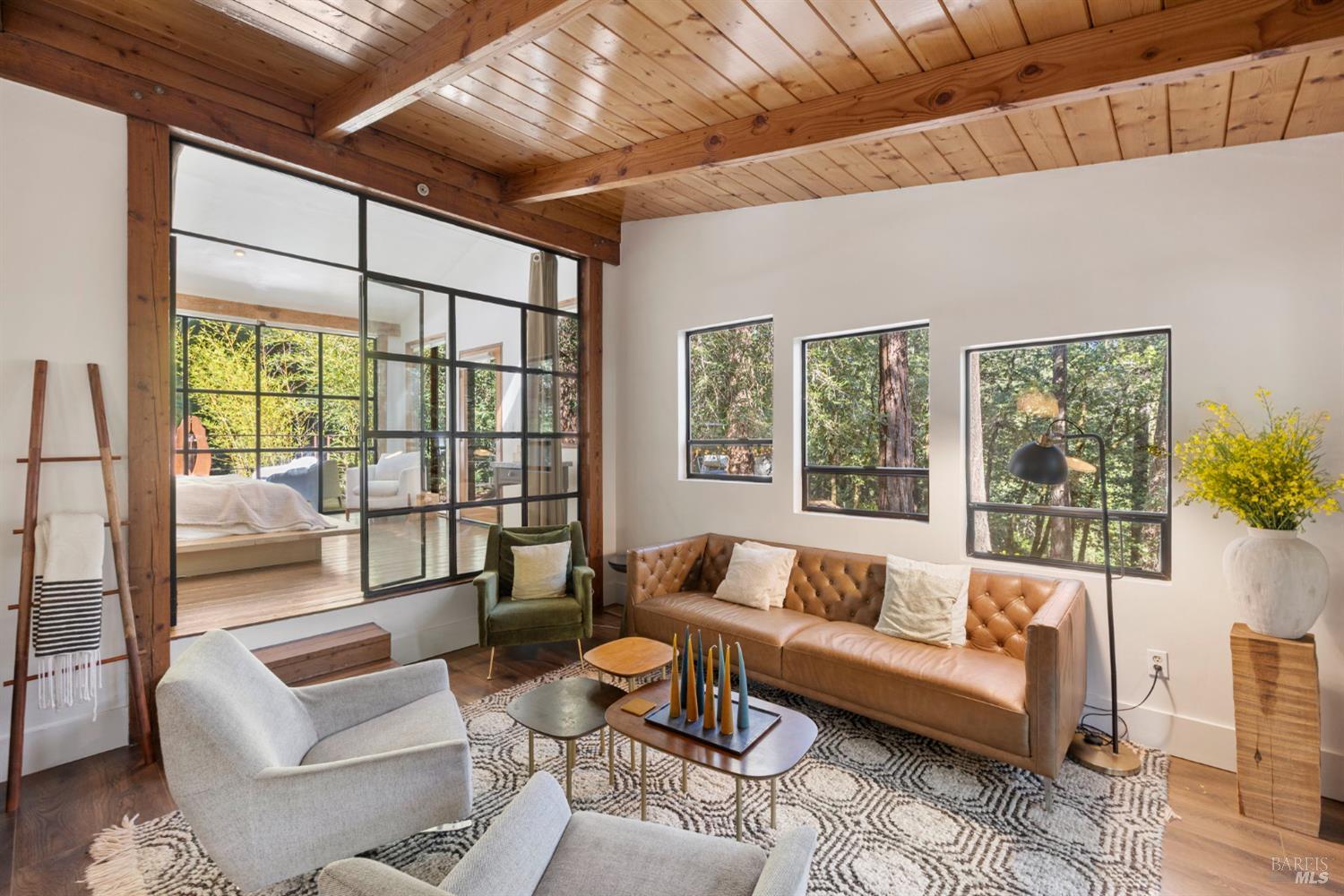 16798 Armstrong Woods Road Guerneville, CA 95446 - Photo 12 of 71 a living room with furniture and a large window