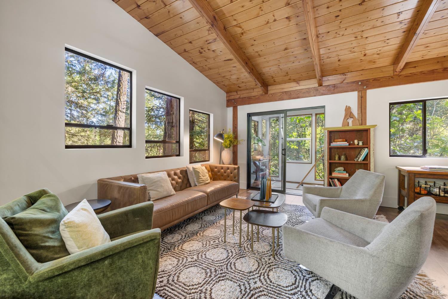 16798 Armstrong Woods Road Guerneville, CA 95446 - Photo 13 of 71 a living room with furniture and a large window