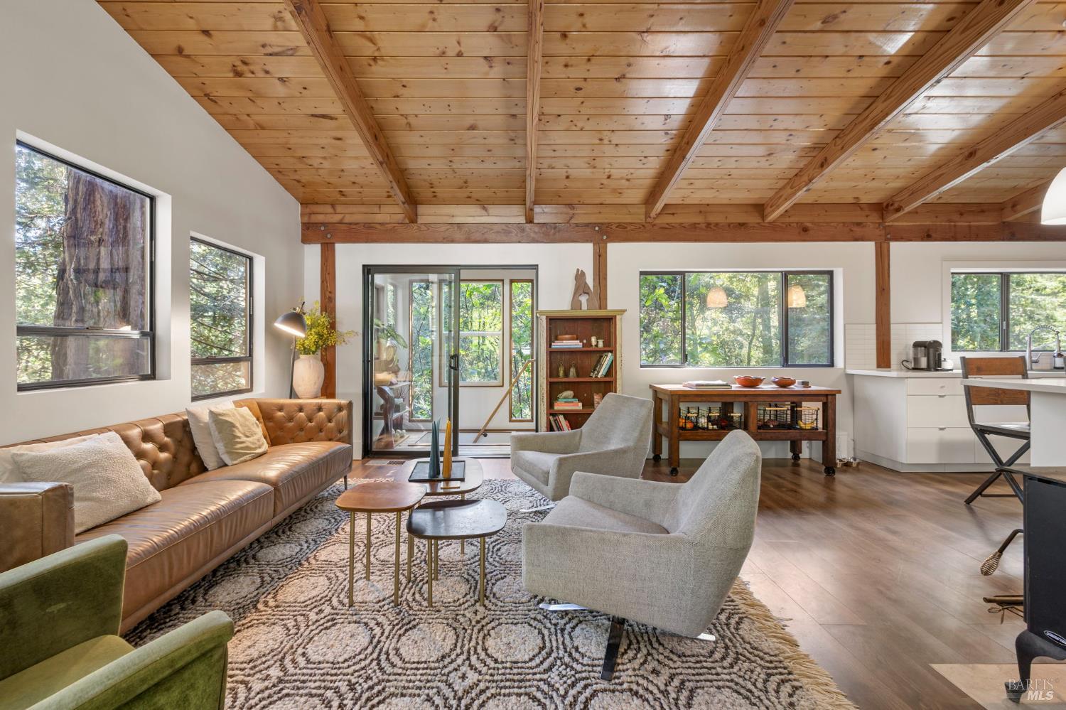 16798 Armstrong Woods Road Guerneville, CA 95446 - Photo 14 of 71 a living room with furniture and a large window