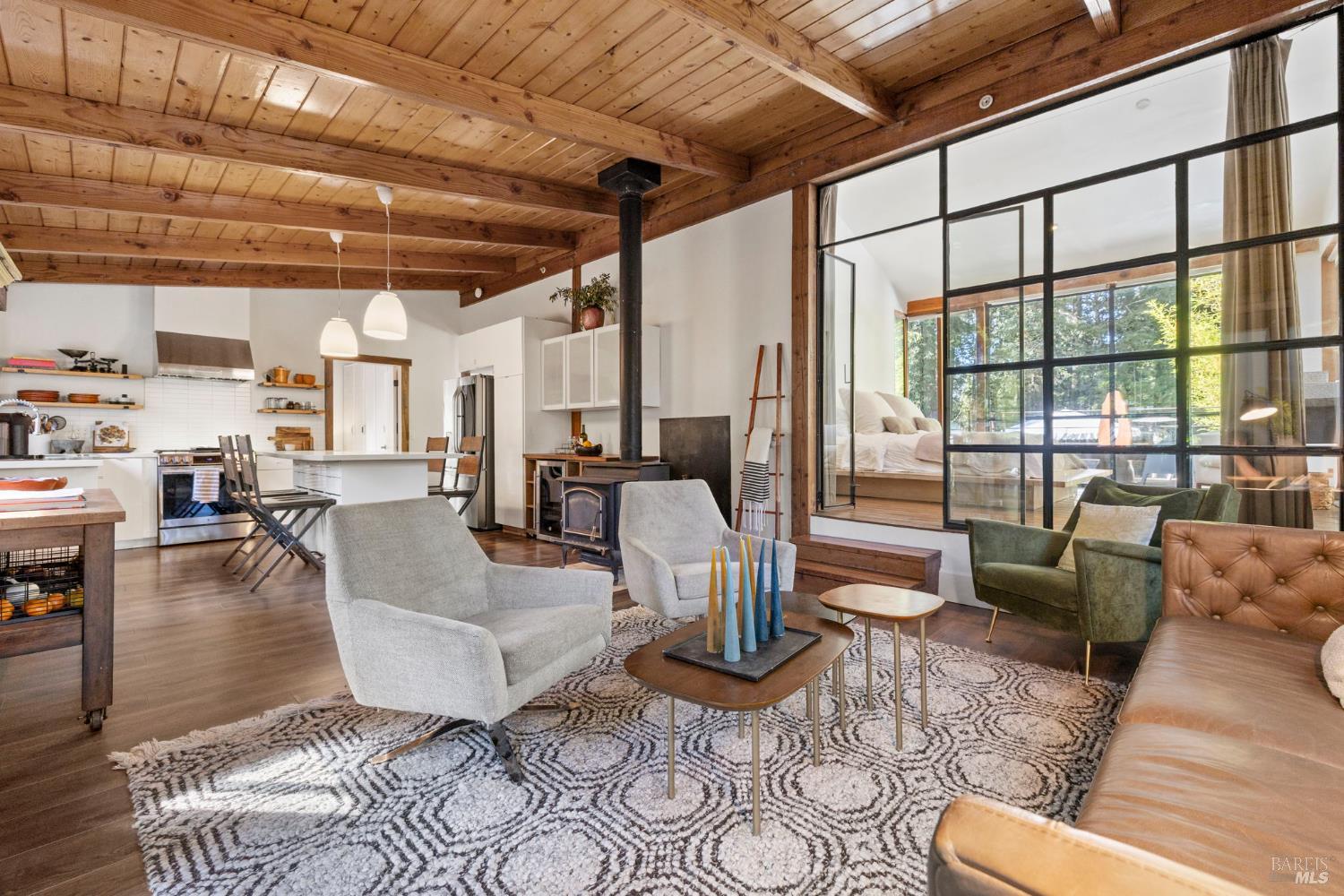 16798 Armstrong Woods Road Guerneville, CA 95446 - Photo 15 of 71 a living room with furniture and a large window